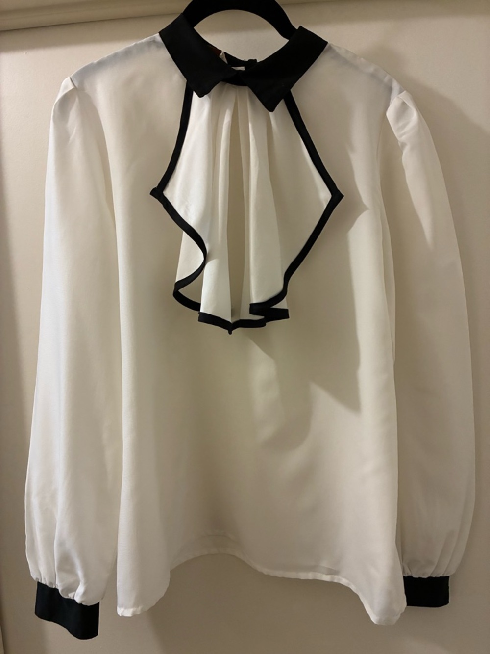 Elegant White Ruffle Front Blouse with Black Trim
